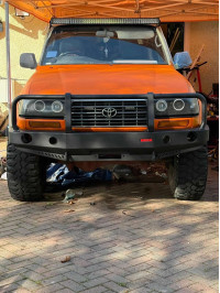 Installation of Fabryka4x4 Front Steel Winch Bumper with Bullbar on a Toyota Land Cruiser 80 Series. Heavy-duty steel construction with integrated winch mount and recovery points. Credit: Photos by Kieron